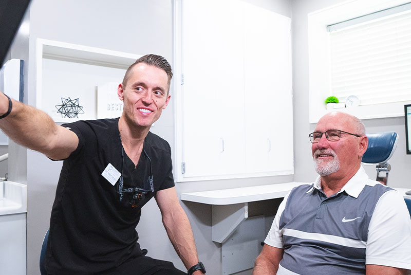 doctor and patient going over dental procedure information within the dental center